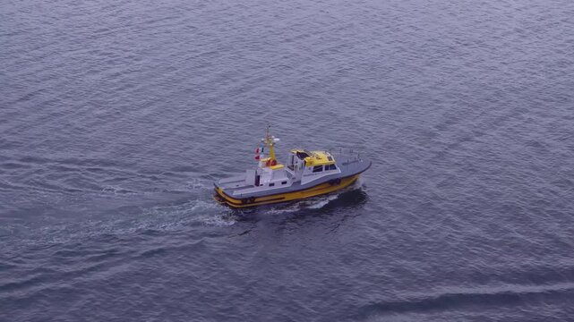 Ensenada, Baja California, Mexico. August 27, 2025: A pilot boat navigates through calm waters, transporting a marine pilot to guide a cruise ship safely in and out of the local harbor.