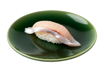 Freshly prepared sushi piece, showcasing delicate fish, displayed on a rich, dark green plate.