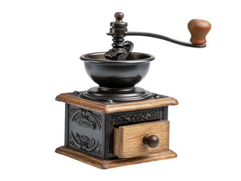 Classic manual coffee grinder with cast-iron top, side handle and wooden drawer, isolated on transparent background.

