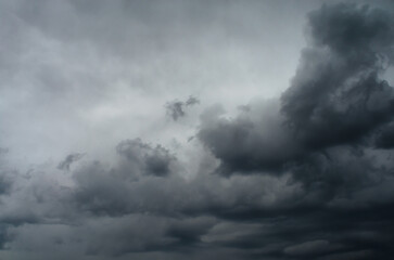 Cumulus storm clouds in dramatic sky creating powerful atmospheric background for weather, climate change, and moody nature concepts