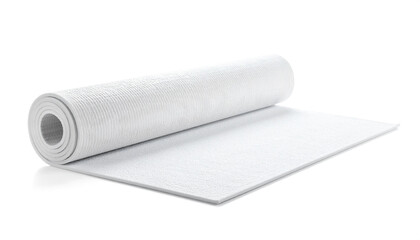 Fototapeta premium Rolled yoga mat unrolled on white surface in studio setting