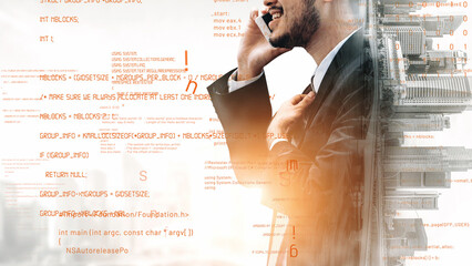 A confident businessman in a suit engages in a phone conversation against an abstract data backdrop, symbolizing technology and modern communication in the workplace. Xenic