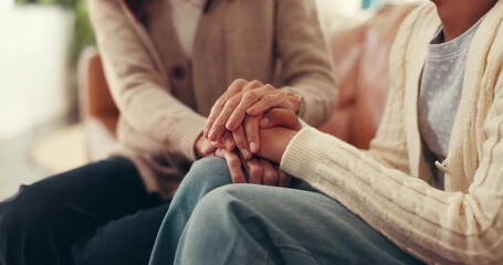 Women, holding hands and empathy in home for trust, compassion and friends with grief and helping. House, care and patience for person in living room, consoling or understanding of trauma or kindness - Powered by Adobe