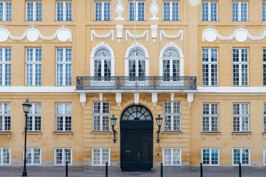 Copenhagen, Denmark- July 16, 2025: Yellow Palace (Bergum's Mansion) town mansion next to Amalienborg Palace in Frederiksstaden district building entrance