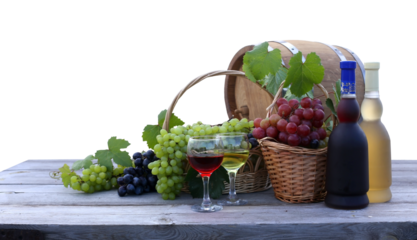 Green, red and black grapes, barrel, bottle of white wine and glass on a wooden table cutout