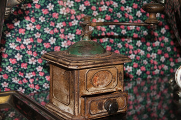 Antique coffee grinder in a coffee shop, vintage style.