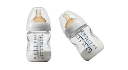 Two Transparent Baby Bottles with Milk and Nipples.