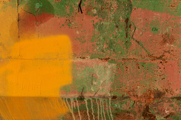 Fragment of an old metal wall. The surface has multi-colored paint stains with streaks and rusty...
