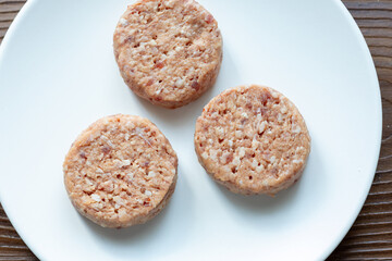 Three Plant-Based Meatballs on a White Plate