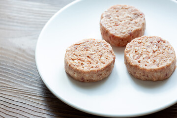 Three Plant-Based Meatballs on a White Plate