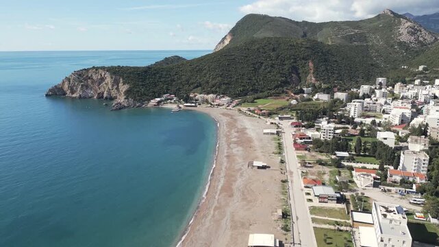 Aerial video showcase a long sandy beach in the town of Canj, Crna Gora.