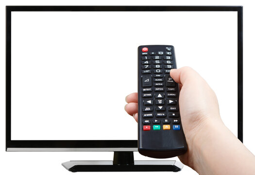 Hand with remote control pointing at modern plasma TV set