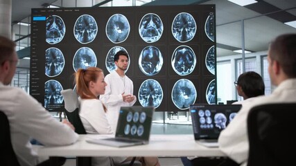 Medical Radiologist Team Group Meeting Looking At MRI Imaging - Powered by Adobe