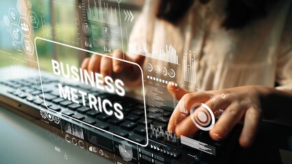 Professional Woman Analyzing Business Metrics Using Laptop with Data Visualization Overlays. Asymptotic smart data analytic.