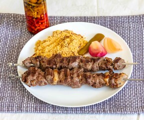 Typical Brazilian barbecue skewer made with filet mignon, a traditional happy hour snack. Espetinho, churrasquinho