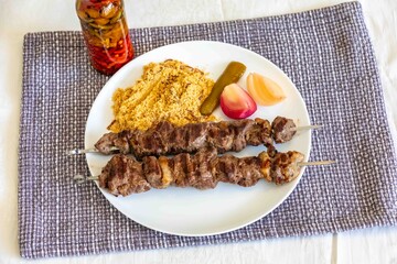 Typical Brazilian barbecue skewer made with filet mignon, a traditional happy hour snack. Espetinho, churrasquinho