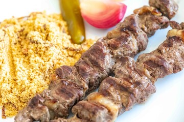 Typical Brazilian barbecue skewer made with filet mignon, a traditional happy hour snack. Espetinho, churrasquinho