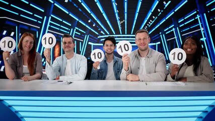 Happy Judges Sitting With Scorecards - Powered by Adobe