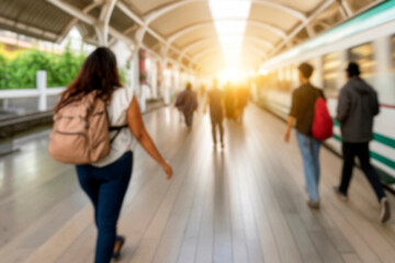 Abstract blurred of passengers walking on walkway at railway station use for the background....