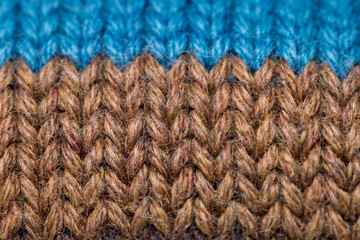 Brown and blue color sweater weave pattern close up view.