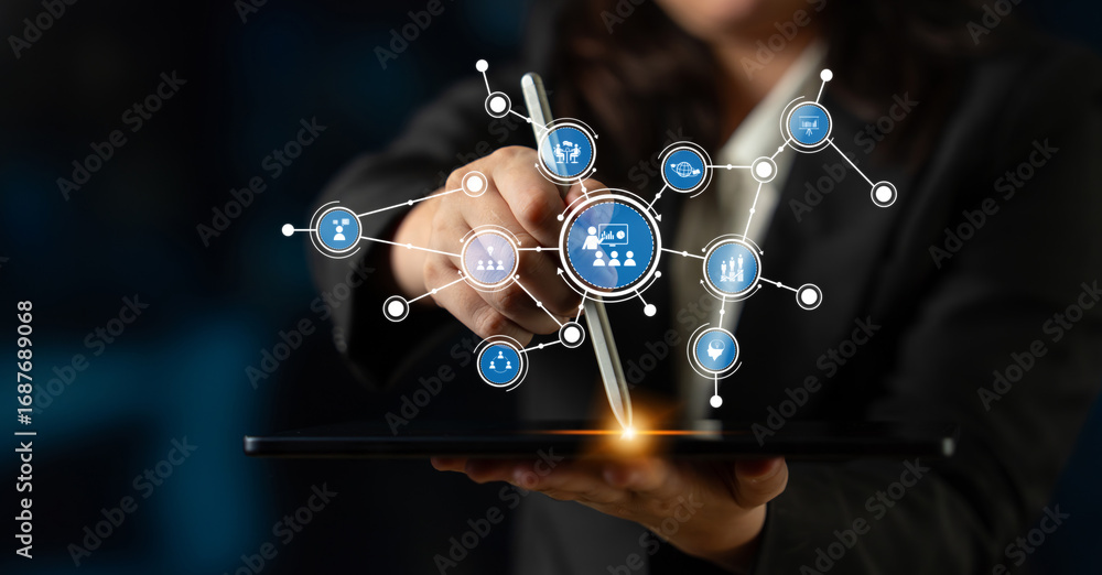 Poster a business professional interacts with a tablet to visualize network data. icons represent innovatio