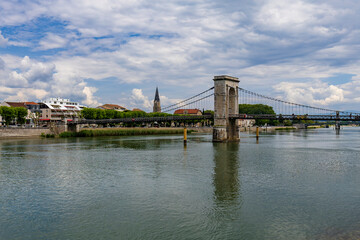 Fototapeta premium At the heart of the Rhône Valley wines Tain l’Hermitage situated on side of the river Rhône. Village in the heart of the famous Hermitage terraced vineyards. Exceptional French wines and vineyards.