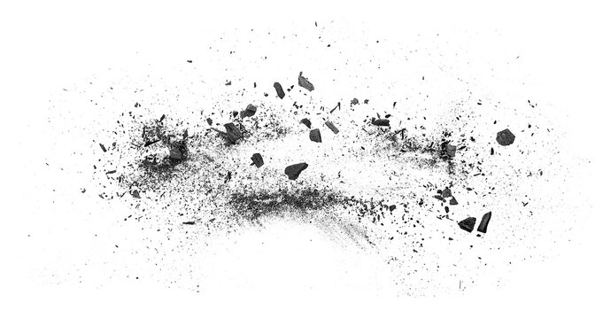Black charcoal particles isolated on a white background, top view. Scattered black charcoal powder, exploding effect.