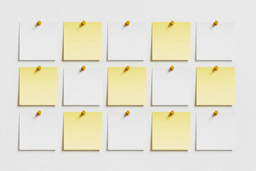  white and pale yellow rectangular sticky notes arranged in a grid pattern on a white background.