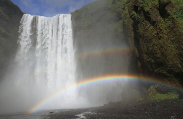 Skogafoss waterfall in Iceland with rainbow