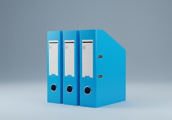 Three blue ring binders standing together on a gray surface