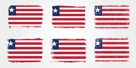Obraz premium Grunge style Liberia flags with red stripes and white star in textured brush stroke designs