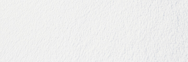Natural snow texture. Smooth surface of clean fresh snow. Snowy ground. Winter background with snow patterns. Perfect for Christmas and New Year design. Closeup top view.