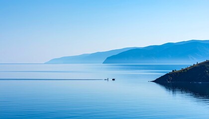 Obraz premium Tranquil lake vista under a serene sky