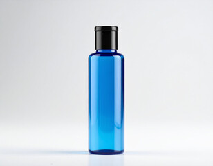 Blue bottle standing upright against a clean white backdrop