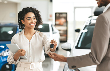 Car Sales Business. Afro Lady Dealer Selling Car To Businessman Client Giving His New Auto Key...
