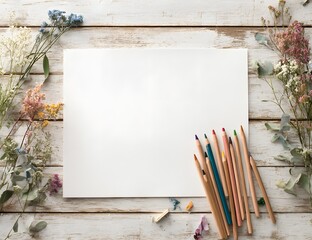 Flat lay of colored pencils and dried flowers on a rustic wooden surface ready for creative inspiration.