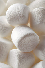 Hyper-realistic macro photo of fluffy rounded marshmallows on a clean white background, ultra-high-resolution detail.