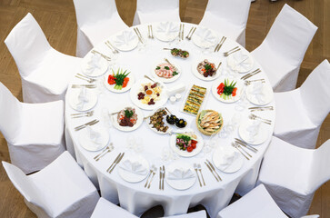 Beautifully organized event - served banquet tables ready for guests