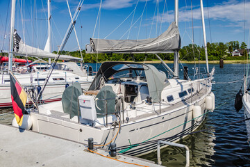 Sailing boat moored at a pier on a sunny day