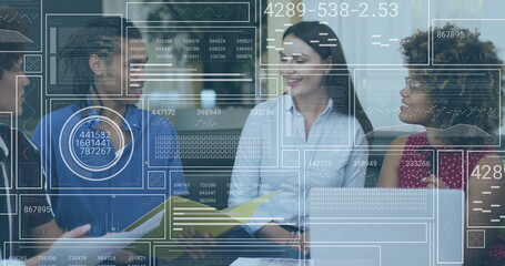 Collaborating four professionals sitting around table in lounge, with laptop and data overlays