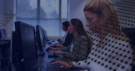 Typing office worker in white blouse with glasses at computer lab, monitors keyboards, copy space