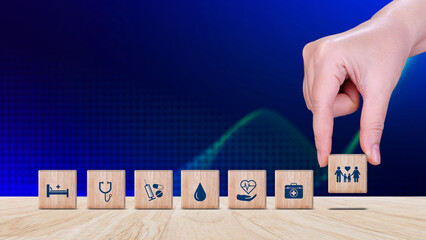 Health Insurance and medical care concept, wooden blocks displaying health related icons, medical care, health insurance, medication. healthcare services, protection, insurance coverage