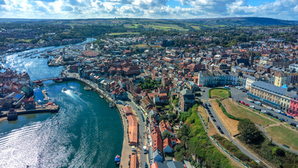 Fishing boats anchored in small coastal harbor town