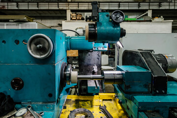 Grinding of machine part on lathe, close up