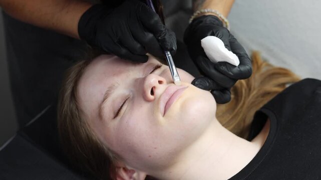 Lip skin preparation before permanent makeup using brush