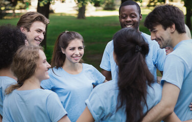 Unity, support and community. Meeting of young volunteers team in park, copy space