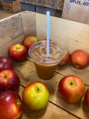 Cold Apple Cider Slushie and Apples in a Wooden Crate