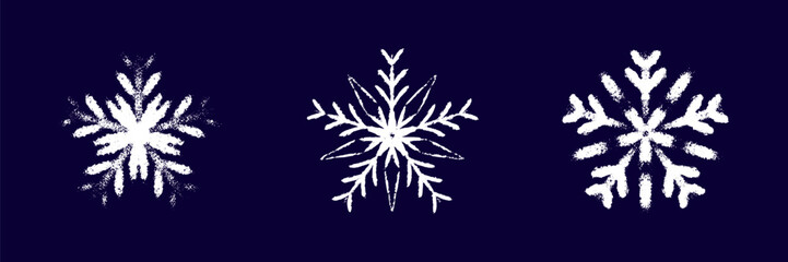 Childish snow flake white chalk drawing on dark blue blackboard. Crayon, pastel whimsical snowflakes hand drawn scribbles. Merry Christmas and Happy New Year winter design elements