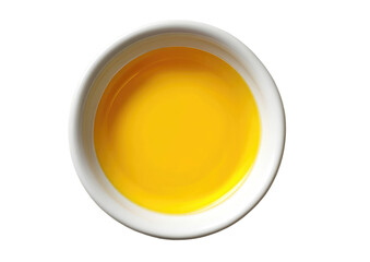 Small white bowl filled with bright yellow liquid
