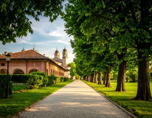 Obraz premium Picturesque pathway through a park, leading to buildings